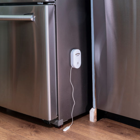 Zircon Leak Alert X smart water detector magnetically attached to a refrigerator